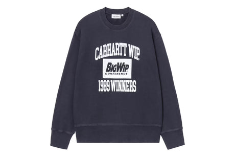 A dark navy blue crewneck sweatshirt featuring a white graphic print on the front that reads 'CARHARTT WIP', 'BigWIP CONFERENCE', and '1993 WINNERS'.