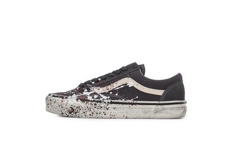 Black sneaker with white sole on a white background