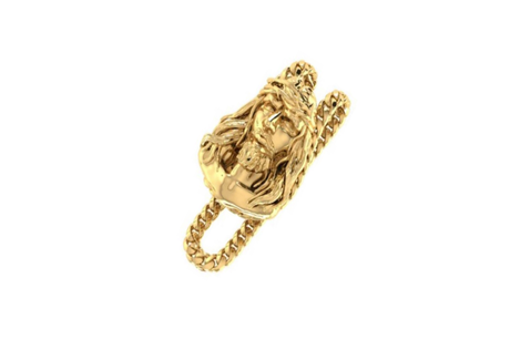 A gold-colored sterling silver money clip with a Jesus piece design on the front and a Cuban link clasp.