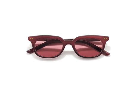 Maroon sunglasses with pink lenses on a white background