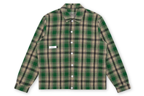 Green and beige plaid shirt on a white background