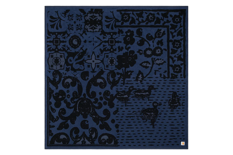 Blaket blue with intricate black patterns on a white background