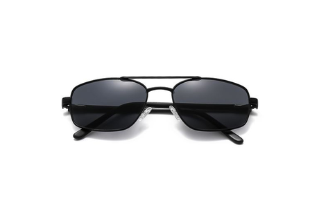 Black sunglasses with dark lenses on a white background