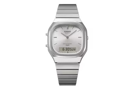 A silver Casio digital watch with a stainless steel link bracelet, featuring a square bezel, a white dial with slim black hands, and a digital display showing 6:30:50.