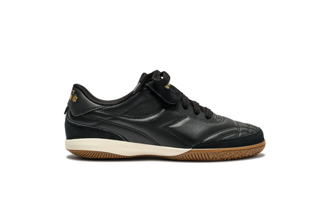 Black sneaker with a white sole on a white background