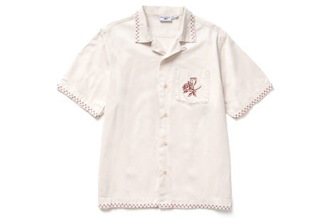 White shirt with red floral embroidery on a white background