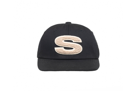Black cap with a beige 'S' logo on a white background