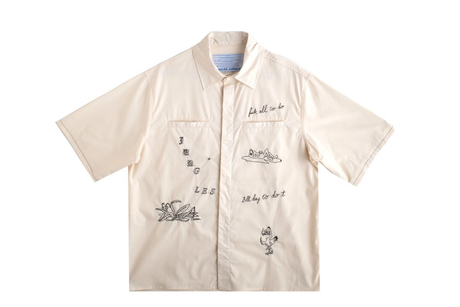 Beige shirt with black text and graphics on a white background
