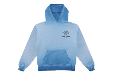 A light blue gradient hoodie with a small black and white graphic and the text 'FENG SHUI' printed on the left chest, displayed against a solid white background.
