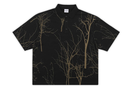 Black polo shirt with tree branch pattern on a white background