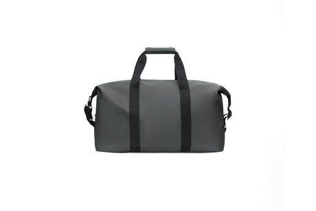 A dark gray duffel bag with black handles and side straps, shown against a plain white background.