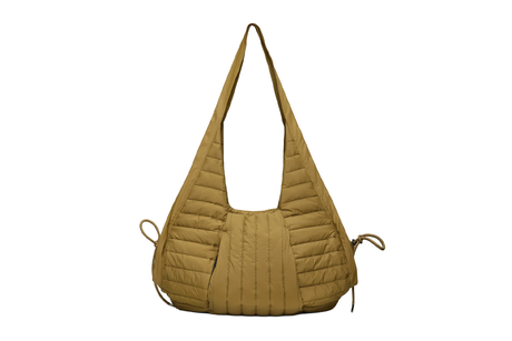 Quilted beige handbag on a white background