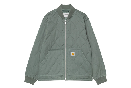 Green quilted jacket on a white background