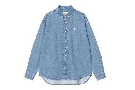 A light blue denim long-sleeve button-down shirt with a small embroidered Carhartt logo on the left chest, displayed flat against a solid white background.