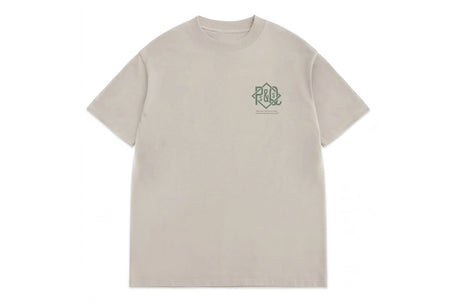 A light beige crewneck t-shirt with a small green graphic logo on the left chest, displayed flat against a solid white background.