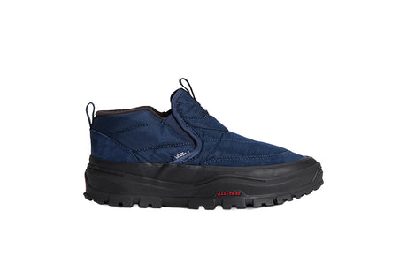 A single dark blue slip-on work boot with a thick black lug sole, shown from the side against a plain white background.