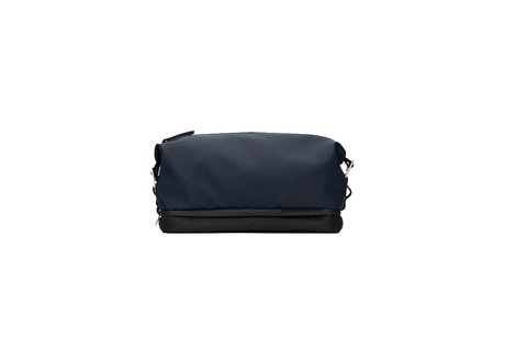 Navy blue toiletry bag with black accents on a white background