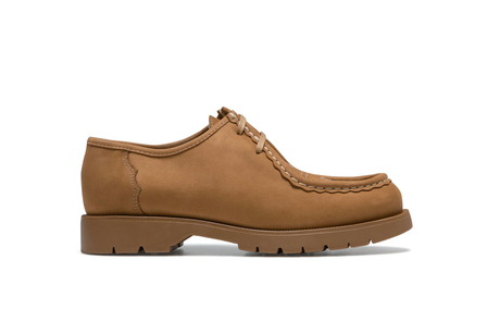 Brown leather shoe on a white background