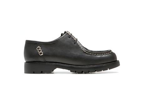 Black leather shoe on a white background