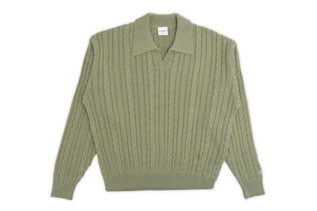 Green long sleeve polo on a white background.