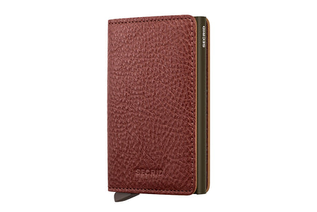 A red textured leather wallet shown closed at a slight angle, featuring a dark olive green metal edge and the SECHIC brand name embossed on the front and side.