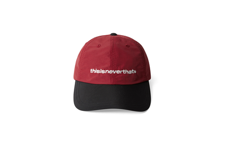 Red and black cap with 'thisisneverthat' logo on a white background