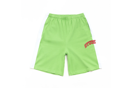 Green shorts with a red logo on a white background