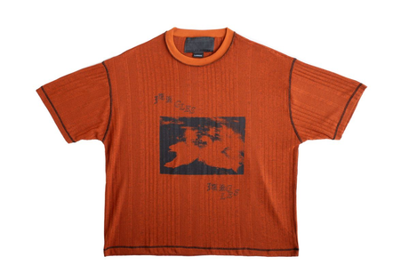 Orange t-shirt with black graphic design on a white background