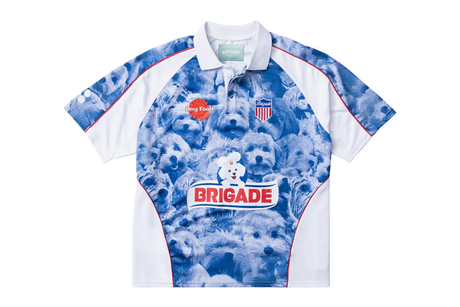 Short-sleeve shirt with blue and white design featuring a logo and text on a white background