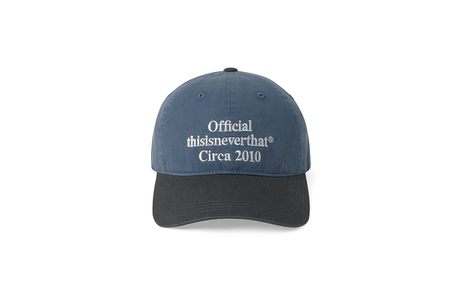 Blue cap with 'Official thisisneverthat Circa 2010' text on a white background