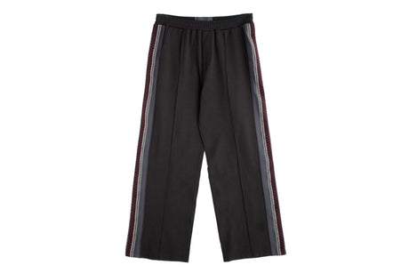 Black wide-leg cropped pants with double vertical striped side panels in red, white, and gray, shown flat against a white background.