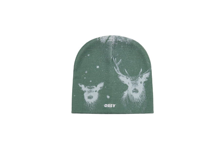 A dark green knit beanie hat featuring a white graphic print of two deer heads and the word 'OBEY' printed near the bottom edge.