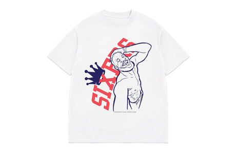 A white short-sleeve t-shirt with a graphic print of a dancing figure in blue outline, red 'SIXTEEN' text, and a blue crown, shown on a plain white background.