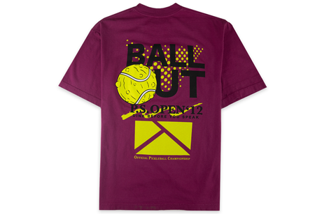 Purple t-shirt with a graphic design on the back featuring a tennis ball and text.