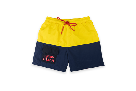 A pair of Snow Beach yellow and blue shorts with a drawstring waist, front pockets, and red embroidery on the left leg.